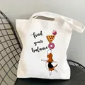 White canvas dog tote bag with find your balance puppy print on a black wire chair - C4 Find Your Balance Dog