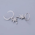 Close-up of silver hoop earrings with palm tree pendants and white zircon stones - Palm Tree - Silver