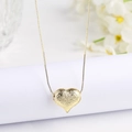 Detailed close-up of a matte gold heart pendant featuring a textured hammered finish on a box chain - Small (18mm) / Gold