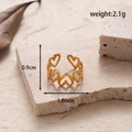 Adjustable golden stainless steel ring featuring five hollow heart-shaped patterns - Five Hollow Hearts / Gold
