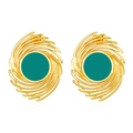 Detailed view of vintage gold spiral earrings with green center enamel and textured patterns - Green