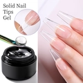 Gel sólido para uñas en tarro negro con aplicación de extensiones transparentes - Gel Sólido para Puntas de Uñas