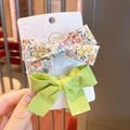 Floral print and solid green bow hair clip set for girls on white display card - Green Floral & Solid Bow Set