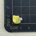 Macro shot of 1.2cm yellow resin letter charm with flower for nail art and DIY crafts - Yellow Stationery