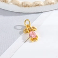 Detailed view of a gold girl charm with a pink teardrop stone and sparkling accents - Little Girl - Pink Heart