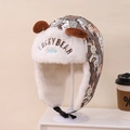 Detail of children's fleece aviator hat with bunny print, ear flaps and buckle strap - Children 3-10 Years Old / Beige Rabbit