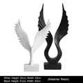Modern black and white resin wing sculptures for home decor in two sizes - A Set Of White And Black Eagle Figurines