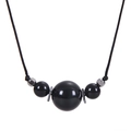 Detail of 16mm natural black stone pendant necklace with woven black cord strap - Obsidian - Necklace
