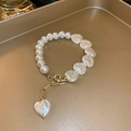Detail of elegant pearl bracelet with heart-shaped pendants and golden OT toggle clasp - 1# Bracelet-White Pearl-Heart