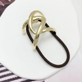 Minimalistisches Haargummi mit poliertem, goldfarbenem Metallknoten im U-Design - Gold
