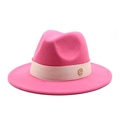Detail of fuchsia wool fedora hat with beige ribbon and golden metal logo emblem - Rose Red