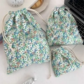 Three sizes of green floral drawstring organizers for travel storage and skincare - Green Flower