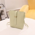 Minimalist mint green bucket crossbody bag with drawstring detail and flat grain finish - Grass Green