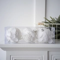 Close-up of three white petal Christmas balls with bead texture in a clear display box - Foam Ball Style / Small