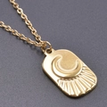 Close-up of gold rectangle pendant necklace with engraved sun and moon rays - Gold Color + Necklace Chain