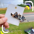 Detail of a cute acetate cat hair clip with sparkling patterns on a white display card - Camo Coffee