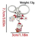 Cute Christmas keychain with Santa, reindeer and pink tree charms in gold finish - ER1782-Santa Tree Reindeer 8-shape Keychain