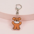 Cute brown cartoon bear acrylic keychain with silver metal clasp on pink stand - Happy Dog