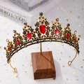Detailed macro view of baroque bridal crown with red drop crystals and black rhinestones - No Comb Antique KC Gold - Black & Red