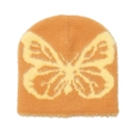 Primo piano del motivo a farfalla jacquard su un berretto invernale in maglia marrone - M(56-58cm) / Giallo