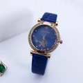 Macro view of blue dial with rose gold crystal bezel and starry镂空 pattern detailing - Blue