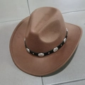 Detail of a brown felt cowboy hat featuring a black decorative band with silver metal studs - Ring Decor Caramel