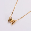 Elegant gold butterfly pendant necklace with clear zircons on a white background - Gold