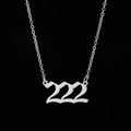 Detailed macro view of silver stainless steel necklace with numeric 222 pendant - 222 Steel