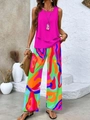 Dettaglio del top rosa senza maniche e pantaloni a gamba larga con stampa astratta - Taglia S / Top e Pantaloni / Rosso rosa