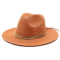 Close-up of khaki woven Panama hat with leather cord and gold bead detailing - Caramel