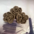 Detail of three brown hand-crocheted 7cm triple-layer flowers on vintage fabric - 7cm / Coffee