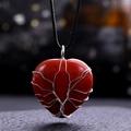 Detail view of heart-shaped red jasper necklace with silver wire life tree wrap decoration - Red Jasper