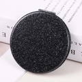 Portable folding round makeup mirror with black glitter finish on an open book - Black Round 70mm ♜