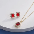 Close-up of gold jewelry set with oval red gems and sparkling zirconia accents - Gold Oval Red (HQ0001(14))