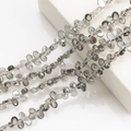 Macro detail of gray faceted crescent crystal beads for jewelry making and DIY designs - Smoke Gray