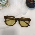 Retro geometric oval sunglasses featuring brown transparent frames and yellow tinted lenses - Green 24