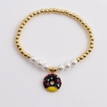 Bracelet pour femmes avec perles dorées, perles blanches et breloque donut émaillé - Noir