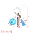 Detail view of Evil Eye keychain featuring a blue tassel, feather pendant, and dimensions - Light Blue Disc Feather Tassel