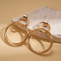 Detail of gold multilayered geometric circular earrings on white marble stone - Stainless Steel Post - Gold