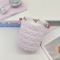 Detail of drawstring storage bag with heart quilted fabric and floral inner lining - Pink Stripe Heart