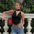 Detail of black halter top featuring a triangular hem and elegant fringe bead tassels - S / Black