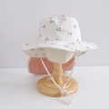 Detailed view of quick-dry sun hat with cherry print and long neck protection flap - 50cm (1-3 Years) / White Cherry