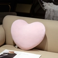 Coussin en peluche rose en forme de cœur sur canapé en cuir avec tissu élastique - Coeur Rose
