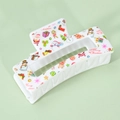 Detail showing white Christmas hair claw with festive Santa and reindeer print patterns - 8.5cm / White