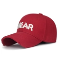 Red distressed baseball cap with white NEAR embroidery and frayed brim detail - Adjustable / Red