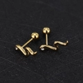 Macro detail of snake-shaped gold screw back earrings with sparkling zircon inlay - Snake - Gold