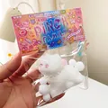 Weißes Plüsch-Katzen-Quetschi mit Perlenkette in Verpackung, 8x7x3.5cm 88g Größe - 3D Weiße Katze