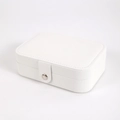 Close-up of white PU leather jewelry box featuring a secure metal snap fastener - White