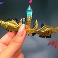 Detail of handmade gold wire wings hair crown with natural dark crystal stones - Black Crystal + Gold Wing Moon