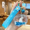 Blue floating goldfish keychain with liquid sand bottle, rabbit strap and bell charm - In-oil Blue Polar Bear - TV